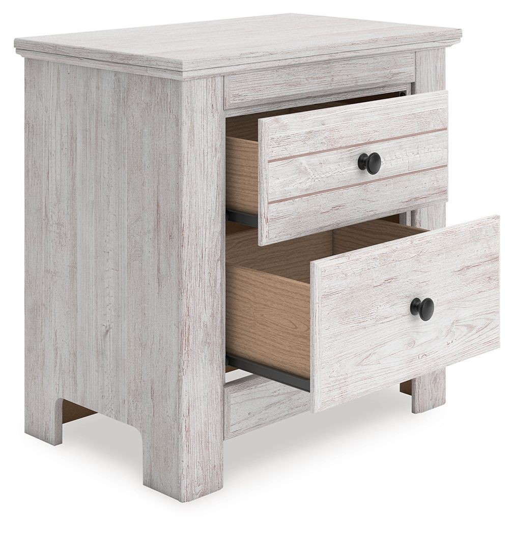 Table de chevet à deux tiroirs — Vous souhaitez créer une chambre aérée et joliment agencée ? Cette table de chevet au confort décontracté est